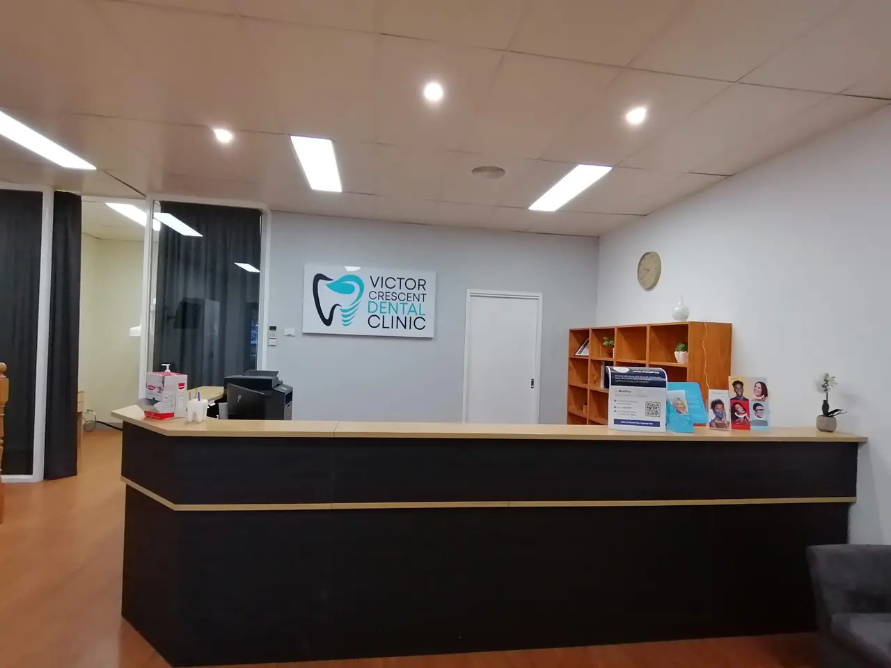The reception desk and waiting area at Victor Crescent Dental Clinic